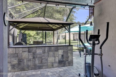 Wonderfully maintained 4 bedroom, 2 & 1/2 bathroom home situated on St. Johns Golf and Country Club in Florida - for sale on GolfHomes.com, golf home, golf lot