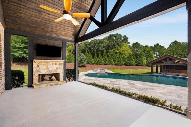 Introducing a rare walk-out main-level oasis in the gated on Manor Golf and Country Club in Georgia - for sale on GolfHomes.com, golf home, golf lot