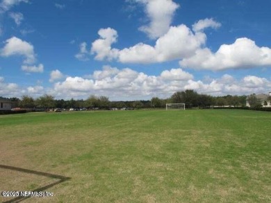 Wonderfully maintained 4 bedroom, 2 & 1/2 bathroom home situated on St. Johns Golf and Country Club in Florida - for sale on GolfHomes.com, golf home, golf lot