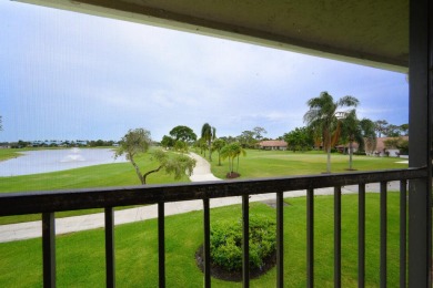 Wake up to stunning lake, golf course, and country club views in on Eastpointe Country Club in Florida - for sale on GolfHomes.com, golf home, golf lot