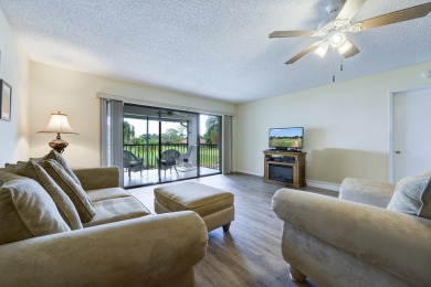 Wake up to stunning lake, golf course, and country club views in on Eastpointe Country Club in Florida - for sale on GolfHomes.com, golf home, golf lot