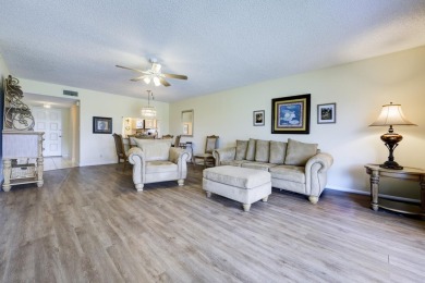Wake up to stunning lake, golf course, and country club views in on Eastpointe Country Club in Florida - for sale on GolfHomes.com, golf home, golf lot