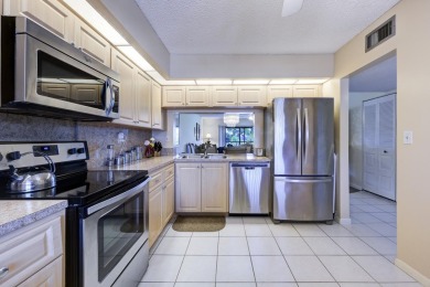Wake up to stunning lake, golf course, and country club views in on Eastpointe Country Club in Florida - for sale on GolfHomes.com, golf home, golf lot