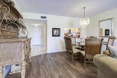 Wake up to stunning lake, golf course, and country club views in on Eastpointe Country Club in Florida - for sale on GolfHomes.com, golf home, golf lot