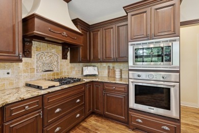 Welcome to luxury living in this stunning 4-bedroom, brick on Glen Oaks Country Club in Iowa - for sale on GolfHomes.com, golf home, golf lot