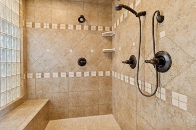 Welcome to luxury living in this stunning 4-bedroom, brick on Glen Oaks Country Club in Iowa - for sale on GolfHomes.com, golf home, golf lot
