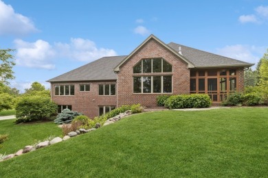 Welcome to luxury living in this stunning 4-bedroom, brick on Glen Oaks Country Club in Iowa - for sale on GolfHomes.com, golf home, golf lot