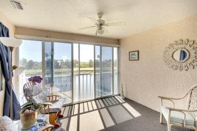 Enjoy stunning lake and golf course views from this lovely on Terra Ceia Golf and Country Club in Florida - for sale on GolfHomes.com, golf home, golf lot
