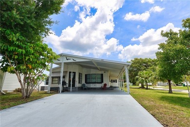 Adorable 2 bed, 2 bath home on a desirable corner lot in on Barefoot Bay Golf Course in Florida - for sale on GolfHomes.com, golf home, golf lot