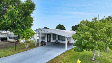 Adorable 2 bed, 2 bath home on a desirable corner lot in on Barefoot Bay Golf Course in Florida - for sale on GolfHomes.com, golf home, golf lot