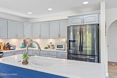 Welcome to your serene retreat in the sought-after beach town of on Oyster Bay Golf Links in North Carolina - for sale on GolfHomes.com, golf home, golf lot