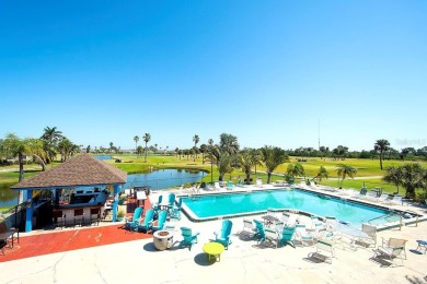Enjoy stunning lake and golf course views from this lovely on Terra Ceia Golf and Country Club in Florida - for sale on GolfHomes.com, golf home, golf lot