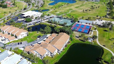 Enjoy stunning lake and golf course views from this lovely on Terra Ceia Golf and Country Club in Florida - for sale on GolfHomes.com, golf home, golf lot