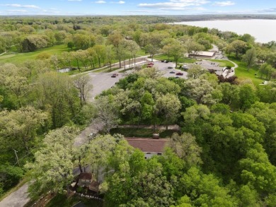 Welcome to your own slice of paradise on Lake Koshkonong! This on Koshkonong Mounds Country Club in Wisconsin - for sale on GolfHomes.com, golf home, golf lot