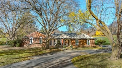 Experience resort-style living with serene, year-round views of on Forest Lake Country Club in Michigan - for sale on GolfHomes.com, golf home, golf lot