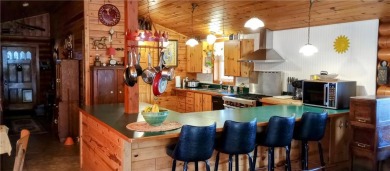 Charming Log Home (with 4 adjoining parcels for over 1 acre of on Hardwoods Golf Club At Mille Lacs in Minnesota - for sale on GolfHomes.com, golf home, golf lot