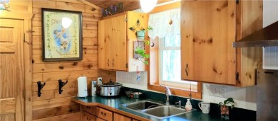 Charming Log Home (with 4 adjoining parcels for over 1 acre of on Hardwoods Golf Club At Mille Lacs in Minnesota - for sale on GolfHomes.com, golf home, golf lot