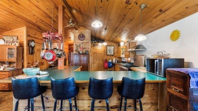 Charming Log Home (with 4 adjoining parcels for over 1 acre of on Hardwoods Golf Club At Mille Lacs in Minnesota - for sale on GolfHomes.com, golf home, golf lot