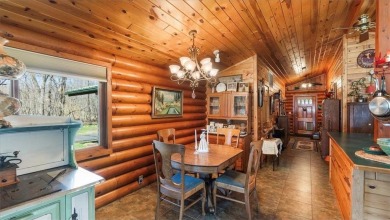 Charming Log Home (with 4 adjoining parcels for over 1 acre of on Hardwoods Golf Club At Mille Lacs in Minnesota - for sale on GolfHomes.com, golf home, golf lot