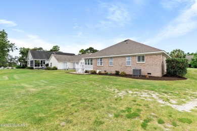 Step inside 7919 Trap Way and you're immediately welcomed into a on Masonboro Country Club in North Carolina - for sale on GolfHomes.com, golf home, golf lot