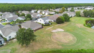 Step inside 7919 Trap Way and you're immediately welcomed into a on Masonboro Country Club in North Carolina - for sale on GolfHomes.com, golf home, golf lot