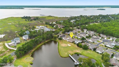 Step inside 7919 Trap Way and you're immediately welcomed into a on Masonboro Country Club in North Carolina - for sale on GolfHomes.com, golf home, golf lot