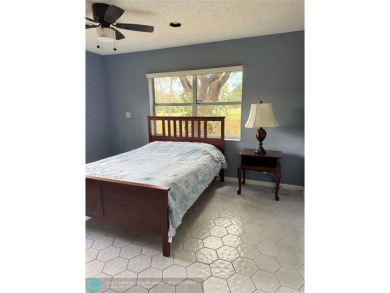 SPACIOUS UPGRADED 3 BEDROOMS, 2 BATHROOMS FIRST FLOOR FALLS OF on Inverrary Country Club in Florida - for sale on GolfHomes.com, golf home, golf lot