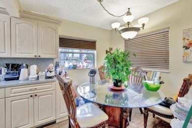 Discover this beautifully upgraded 2nd-floor corner unit in the on Flamingo Lakes Country Club in Florida - for sale on GolfHomes.com, golf home, golf lot