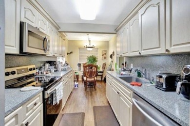 Discover this beautifully upgraded 2nd-floor corner unit in the on Flamingo Lakes Country Club in Florida - for sale on GolfHomes.com, golf home, golf lot