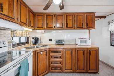 Under contract-accepting backup offers. Escape Winter and on Betmar Acres Golf Club in Florida - for sale on GolfHomes.com, golf home, golf lot