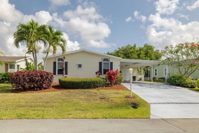 Enjoy peaceful water views and your own Mango Tree from this on Savanna Golf Club in Florida - for sale on GolfHomes.com, golf home, golf lot