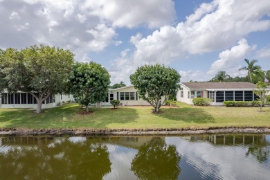 Enjoy peaceful water views and your own Mango Tree from this on Savanna Golf Club in Florida - for sale on GolfHomes.com, golf home, golf lot