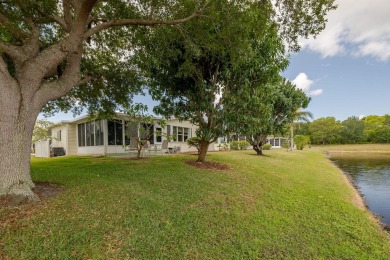 Enjoy peaceful water views and your own Mango Tree from this on Savanna Golf Club in Florida - for sale on GolfHomes.com, golf home, golf lot