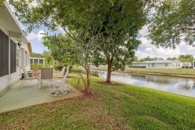 Enjoy peaceful water views and your own Mango Tree from this on Savanna Golf Club in Florida - for sale on GolfHomes.com, golf home, golf lot