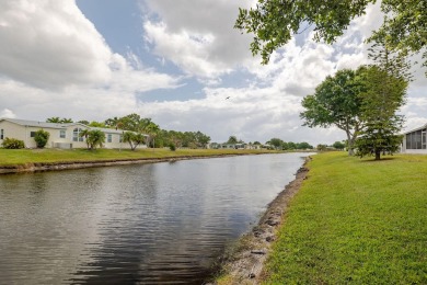 Enjoy peaceful water views and your own Mango Tree from this on Savanna Golf Club in Florida - for sale on GolfHomes.com, golf home, golf lot