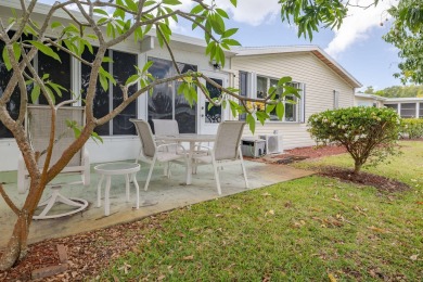 Enjoy peaceful water views and your own Mango Tree from this on Savanna Golf Club in Florida - for sale on GolfHomes.com, golf home, golf lot