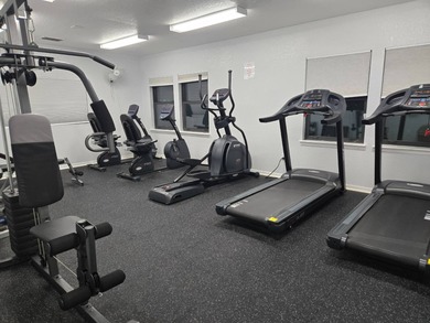 Experience Florida living in this 2-bedroom, 1-bathroom home on Lake Henry Golf Club in Florida - for sale on GolfHomes.com, golf home, golf lot