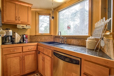 This charming home is on a corner lot with common property on on DeSoto Golf Course in Arkansas - for sale on GolfHomes.com, golf home, golf lot