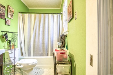 This charming home is on a corner lot with common property on on DeSoto Golf Course in Arkansas - for sale on GolfHomes.com, golf home, golf lot