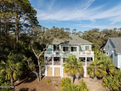 Discover your dream coastal retreat with this stunning reverse on Ocean Creek Golf Course in South Carolina - for sale on GolfHomes.com, golf home, golf lot