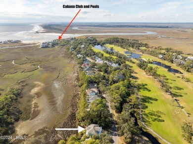 Discover your dream coastal retreat with this stunning reverse on Ocean Creek Golf Course in South Carolina - for sale on GolfHomes.com, golf home, golf lot