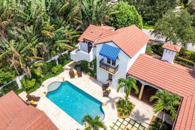 This custom built 4 bedroom, 4.5 bath exquisite courtyard home on Old Marsh Golf Club in Florida - for sale on GolfHomes.com, golf home, golf lot