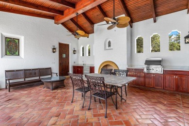 This custom built 4 bedroom, 4.5 bath exquisite courtyard home on Old Marsh Golf Club in Florida - for sale on GolfHomes.com, golf home, golf lot