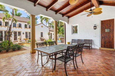 This custom built 4 bedroom, 4.5 bath exquisite courtyard home on Old Marsh Golf Club in Florida - for sale on GolfHomes.com, golf home, golf lot