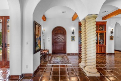 This custom built 4 bedroom, 4.5 bath exquisite courtyard home on Old Marsh Golf Club in Florida - for sale on GolfHomes.com, golf home, golf lot
