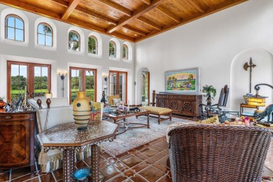 This custom built 4 bedroom, 4.5 bath exquisite courtyard home on Old Marsh Golf Club in Florida - for sale on GolfHomes.com, golf home, golf lot