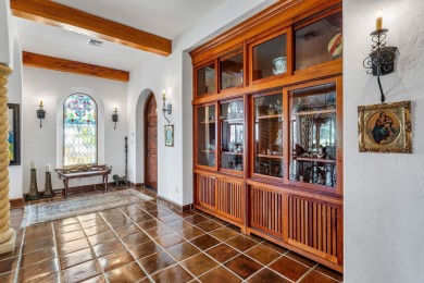 This custom built 4 bedroom, 4.5 bath exquisite courtyard home on Old Marsh Golf Club in Florida - for sale on GolfHomes.com, golf home, golf lot