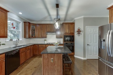 Welcome to this spacious and well-maintained 5-bedroom, 3-bath on Hampton Golf Village in Georgia - for sale on GolfHomes.com, golf home, golf lot