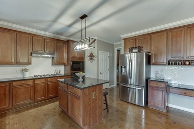 Welcome to this spacious and well-maintained 5-bedroom, 3-bath on Hampton Golf Village in Georgia - for sale on GolfHomes.com, golf home, golf lot