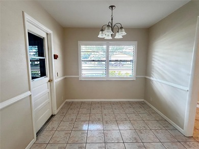 MOVE IN CONDITION!  Nestled on a beautifully landscaped and tree on Cypresswood Golf and Country Club in Florida - for sale on GolfHomes.com, golf home, golf lot